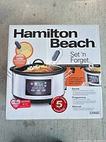 Front of sealed box showing Hamilton Beach Set 'n Forget programmable 6-L slow cooker, model 33966C with probe