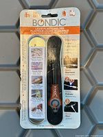 Front view of sealed Bondic liquid plastic welder kit on blister card