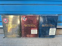 Front view of three sealed Special Extended Edition DVD sets: Fellowship of the Ring, Two Towers, Return of the King