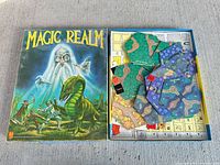 Outer box alongside opened box displaying tiles and counters