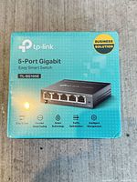 Front of sealed TP-Link TL-SG105E switch box showing brand, model, and five Ethernet ports image
