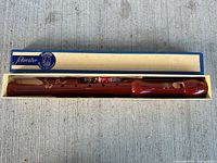 recorder inside open box showing full length and finger holes