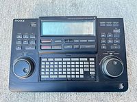 Front view of Sony RM-E700 controller showing overall layout and wear