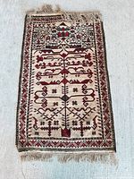 Full view of tapestry showing entire design, colours and fringe