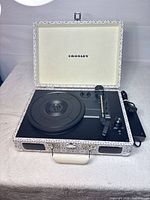 Open Crosley suitcase turntable with accessories visible