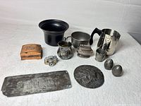 Group shot of all ten assorted metalware and collectible items
