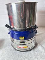 Premier wet grinder exterior showing stainless drum and blue base