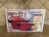 Front of Pasta Perfect retail box showing images of the red pots and bonus items