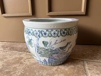 side view showing peacock scene and decorative borders