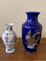 Two vases side by side, showing relative sizes and designs