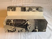 outer cardboard box showing printed glass-blowing illustration