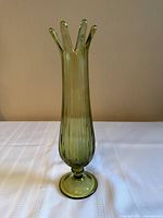 Full front view of green swung glass vase