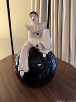 Front view of ceramic Pierrot clown jar