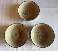 Three herb illustration stoneware bowls overview
