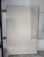 Front view of beige fabric acoustic panel