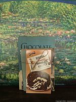 Front view of stacked pamphlets tied together showing primary cover