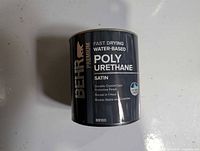 Front label showing BEHR Premium fast drying water-based polyurethane satin 1-quart can