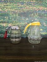 Both glass syrup dispensers front view