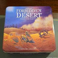 Forbidden Desert tin closed showing lid artwork