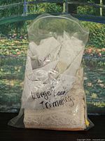 Front view of sealed bag showing assorted lace trims