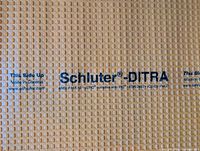 Close-up of Schluter-DITRA branding and grid pattern