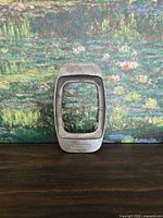 Front view of Uebel French fry cutter showing wire grid and frame