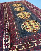 Angled close view of rug surface highlighting colors and pile