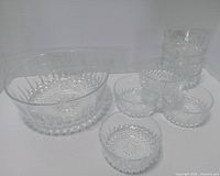 complete set: one large and eight small clear crystal bowls