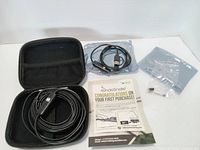 Complete kit laid out: camera cable, interface module, adapters, guide, open case