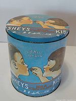 Front view of blue Hershey's Kisses tin