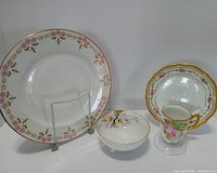Front view of all four porcelain pieces