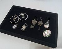 front view of all jewellery pieces on display tray