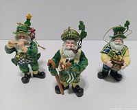 Front view of three Patrick O'Santa ornaments