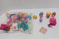 Lot overview showing figures, accessories and storage cubes