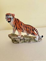 front view of Bengal Tiger figurine on rock base