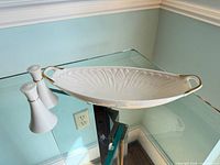 Platter and shakers on glass table