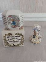 Money box on original Wedgwood box beside Lady Mouse figurine