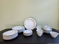 Full set arranged showing stacks of plates, bowls and cups