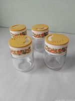 Four Gemco Spice of Life jars angled view