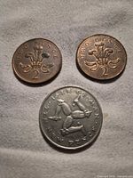 Reverse sides showing designs and denominations