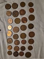 All coins laid out in grid showing obverse designs