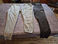 Three sweatpants laid out showing overall colors and style