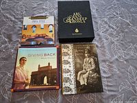 Group shot of four hardcover books