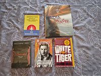 All five books front covers visible