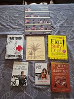 All six books laid out showing front covers