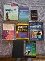 All eight textbooks displayed cover up on a table