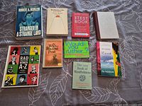 All nine books arranged face up showing covers