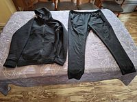Hoodie and joggers laid flat on table