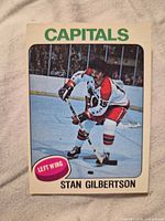 Front of Stan Gilbertson Capitals trading card showing player image and card graphics