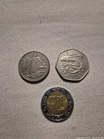 Obverse showing Barbados $1 and 25¢ reverses and Mexico $2 reverse